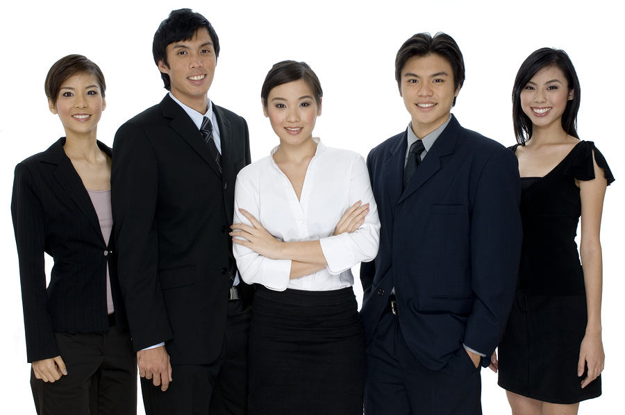 a small business team of young asian professionals on white background