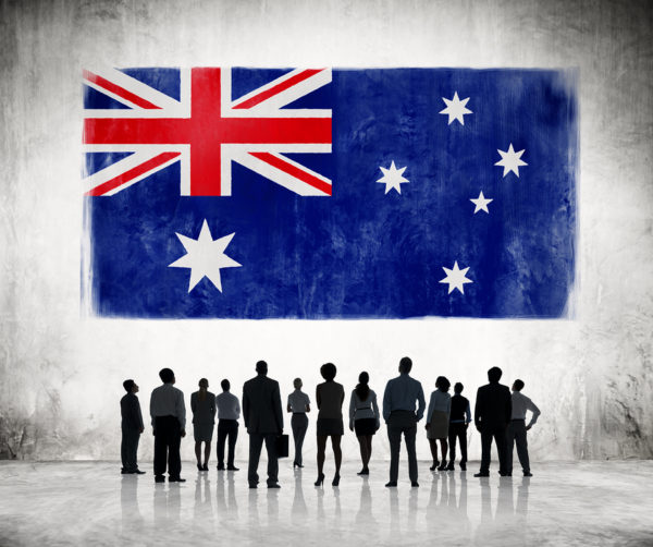 Silhouettes Of Business People Looking At The Australian Flag Silhouettes of Business People Looking at the Australian Flag