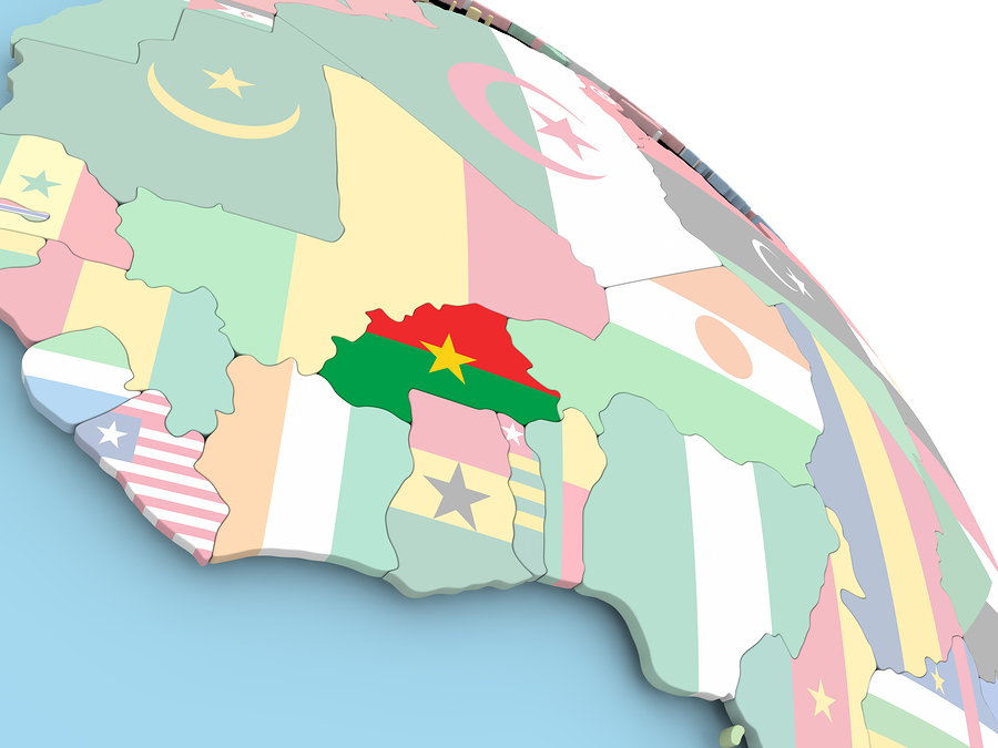 3D render of Burkina Faso with flag on bright globe. 3D illustration.