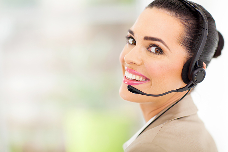 cheerful female call center telemarketer with headset