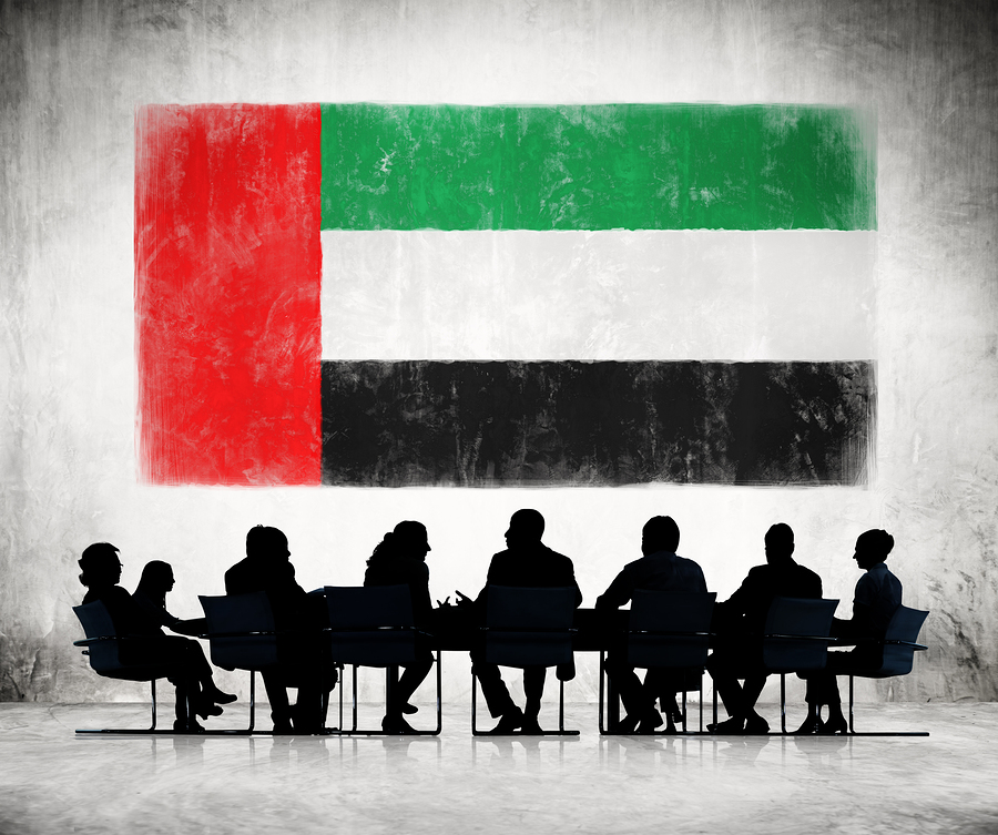 Business People In A Meeting With United Arab Emirates Flag Business People in a Meeting with United Arab Emirates Flag