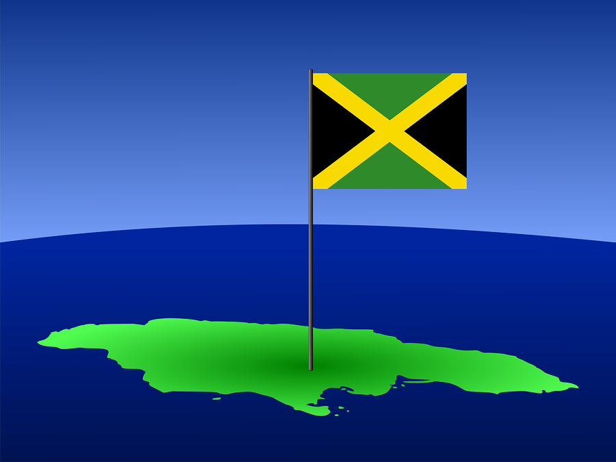 map of Jamaica and Jamaican flag on pole illustration