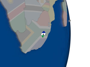 Map of Lesotho with its flag on globe. 3D illustration