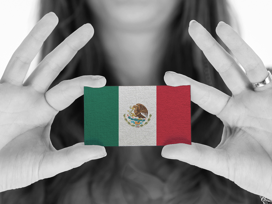 Woman showing a business card black and white Mexico