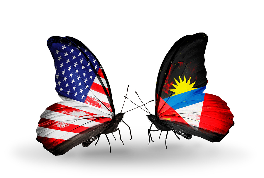 Two butterflies with flags on wings as symbol of relations USA and Antigua and Barbuda