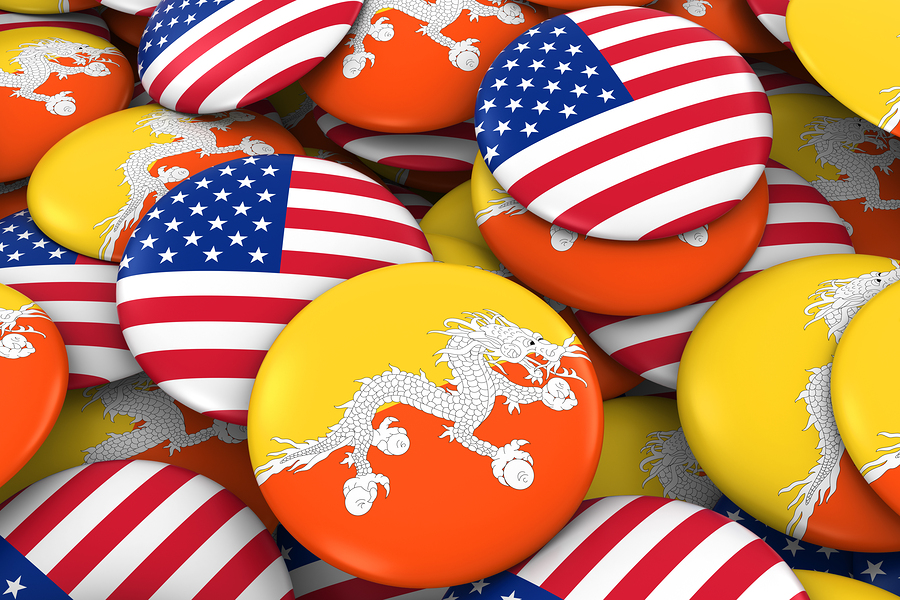 Usa And Bhutan Badges Background Pile Of American And Bhutanes USA and Bhutan Badges Background - Pile of American and Bhutanese Flag Buttons 3D Illustration