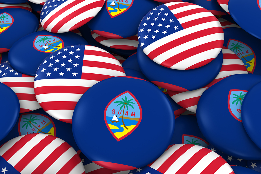 USA and Guam Badges Background - Pile of American and Guamanian Flag Buttons 3D Illustration