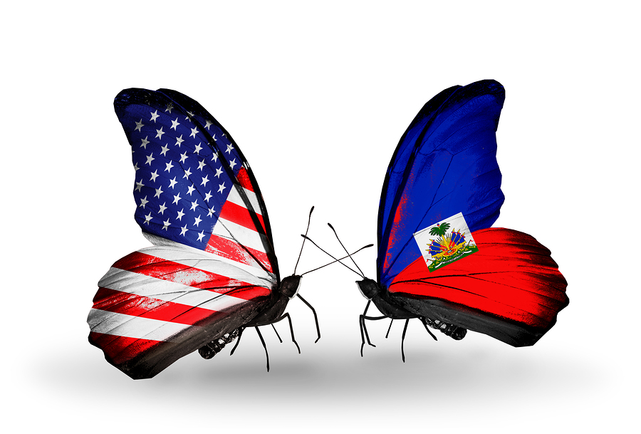 Two butterflies with flags on wings as symbol of relations USA and Haiti