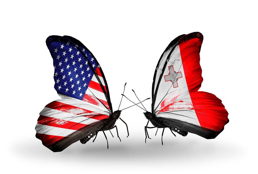 Two butterflies with flags on wings as symbol of relations USA and Malta