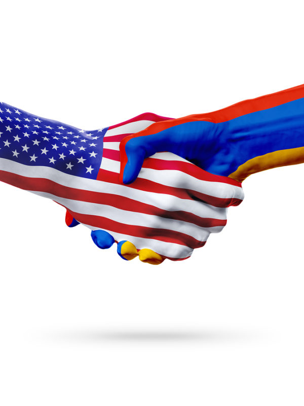 Flags United States and Armenia countries handshake cooperation partnership and friendship or sports competition isolated on white